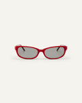 Face shot of Bonnie Clyde Trinket sunglasses in layered red with grey lenses.