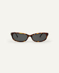 Face shot of Bonnie Clyde Trinket sunglasses in tortoise with black lenses.