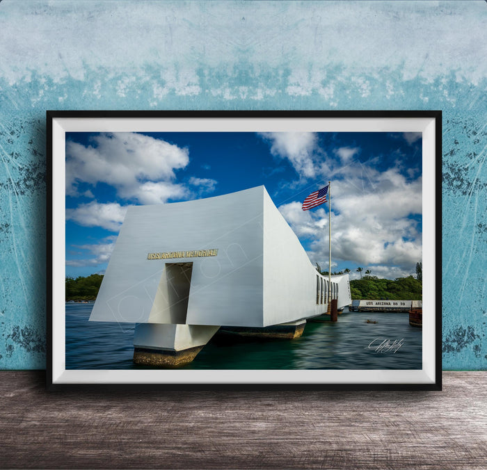 the memorial at Pearl Harbor, Hawaii, with the American flag flying in the background.