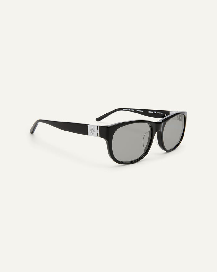 Quarter shot of Bonnie Clyde Valentine sunglasses in black with grey lenses.