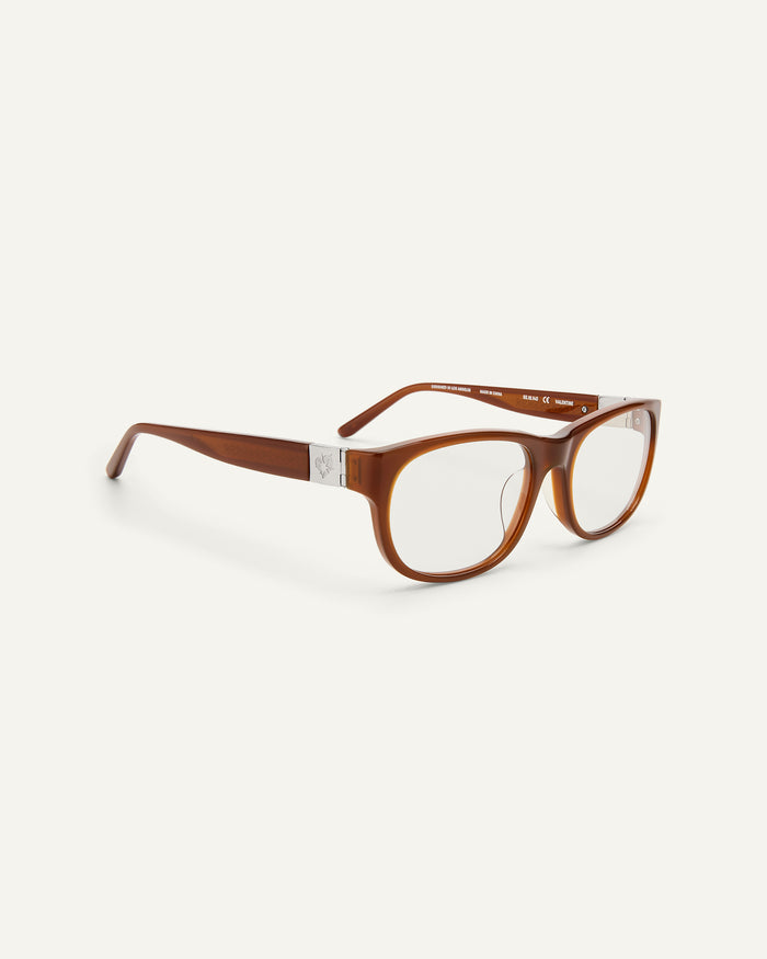 Quarter shot of Bonnie Clyde Valentine sunglasses in cloudy brown with clear lenses.