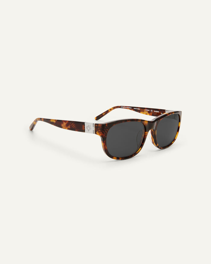 Quarter shot of Bonnie Clyde Valentine sunglasses in tortoise with black lenses.
