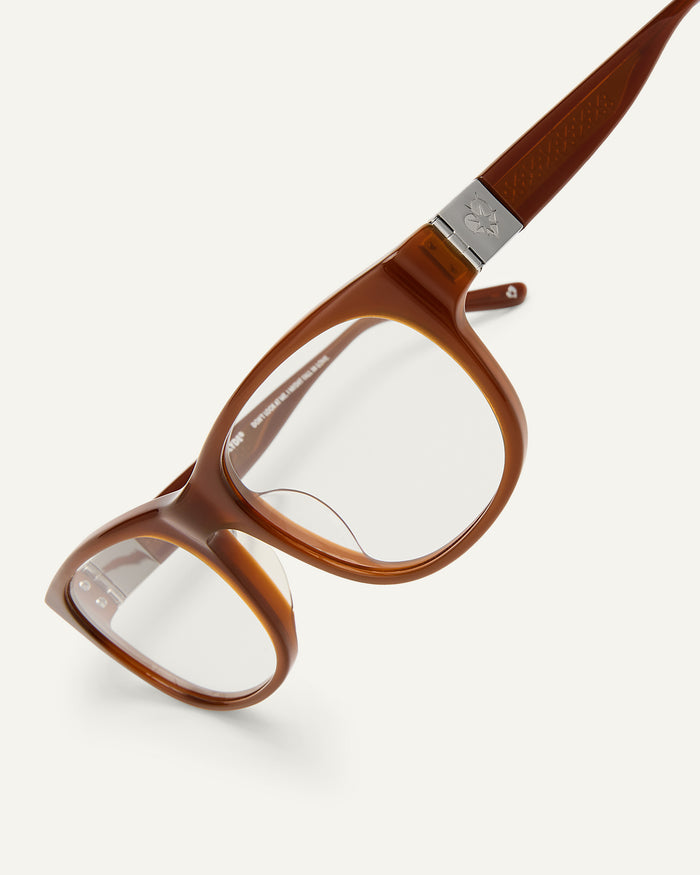 Side shot of Bonnie Clyde Valentine sunglasses in cloudy brown with clear lenses.