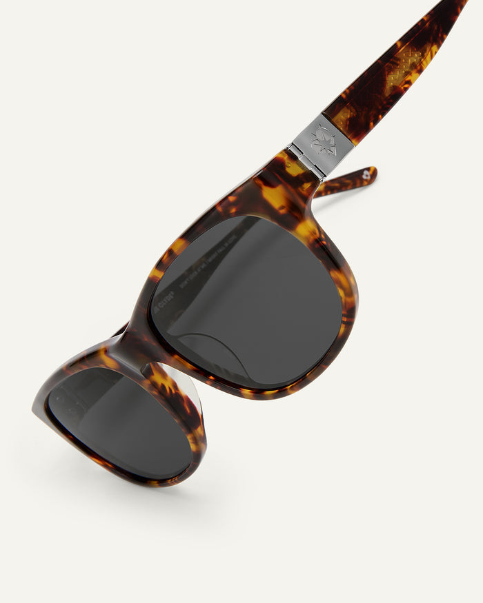 Side shot of Bonnie Clyde Valentine sunglasses in tortoise with black lenses.