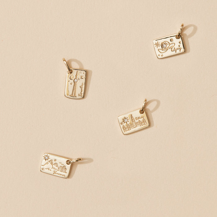 Vancouver Postcard Charm in 10k yellow gold with brilliant diamond, studio detail view