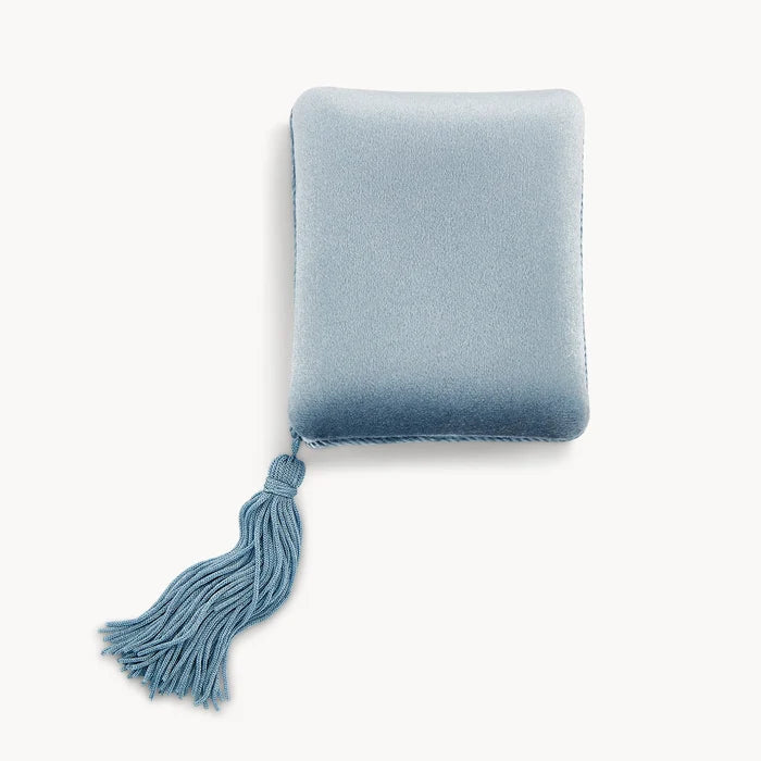 A luxurious, rectangular light blue velvet tassel box from bluboho, featuring a smooth texture. The box is adorned with a decorative matching blue tassel attached to one of its corners, hanging down elegantly. The background is plain white.