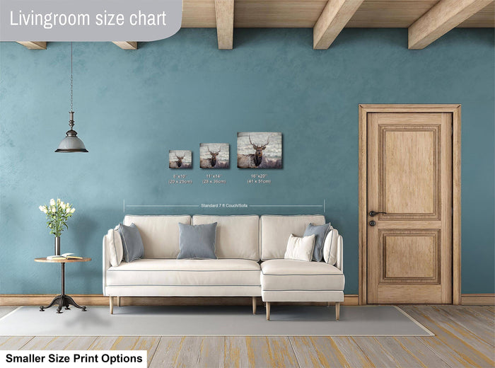 a living room with a white sofa, a wooden door, and a hanging light fixture. There are three framed pictures of deer on the wall above the sofa, and the text indicates that the living room is designed for smaller size print options.