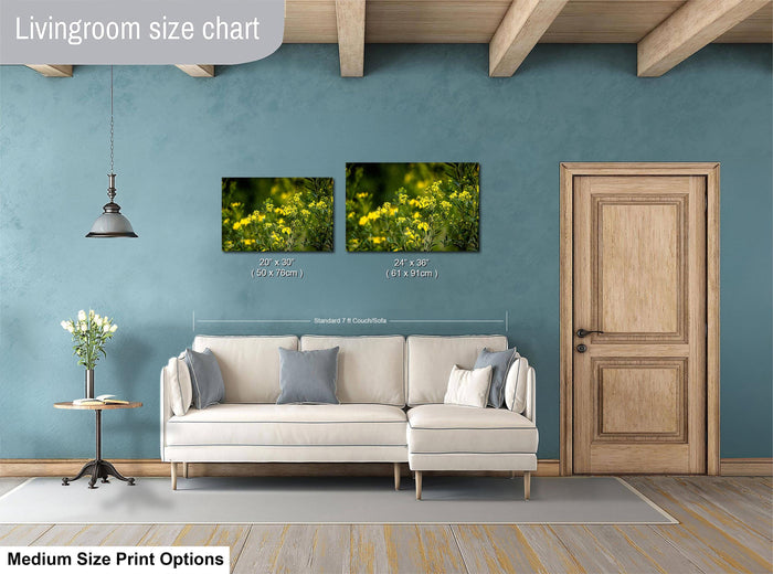 a living room with a white sofa, a wooden door, and a painting of yellow flowers on the wall. The living room appears to be well-lit and decorated with a modern style.