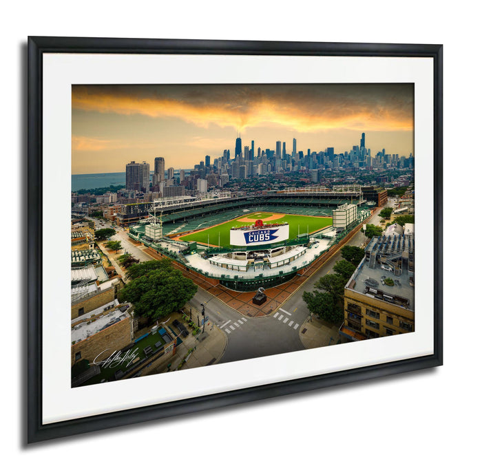 The image is a framed aerial view of a baseball stadium in Chicago, Illinois, with the city skyline in the background.