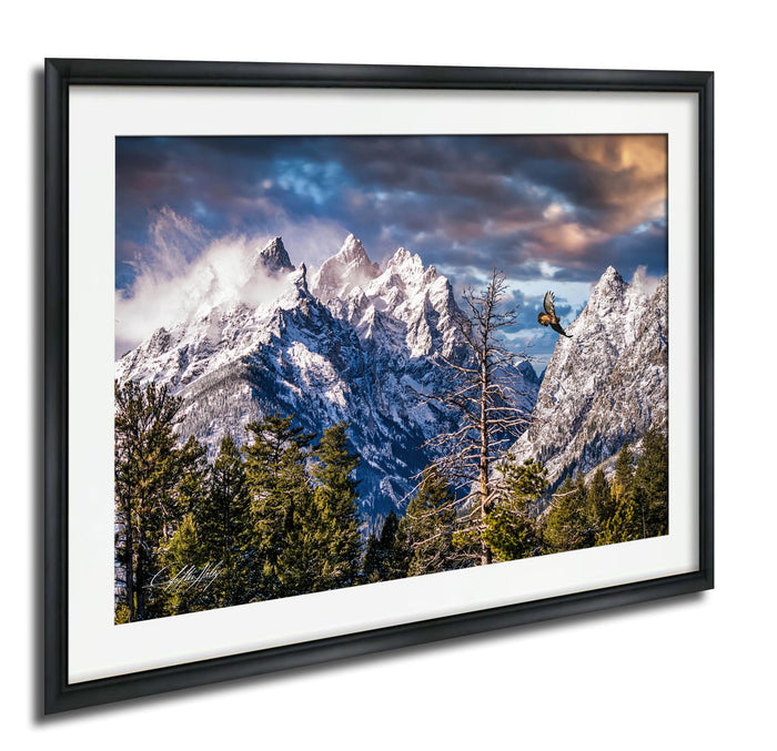 a breathtaking mountain landscape with snow-capped peaks, a lone tree, and a bird soaring in the sky.