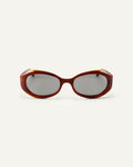 Face shot of Bonnie Clyde XOXOx2 sunglasses in tortoise with grey lenses.