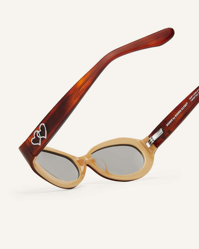 Side shot of Bonnie Clyde XOXOx2 sunglasses in tortoise with grey lenses.