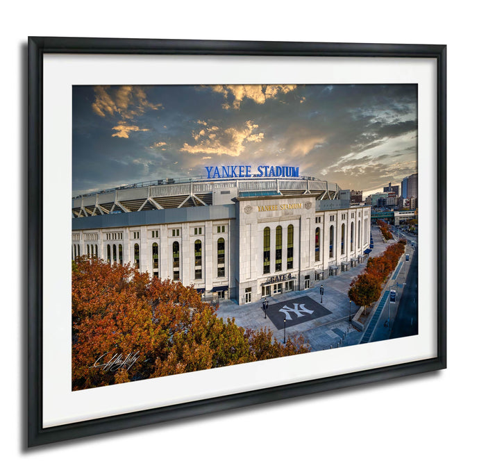 the Yankee Stadium, a baseball stadium located in New York City, with a dramatic sky in the background.