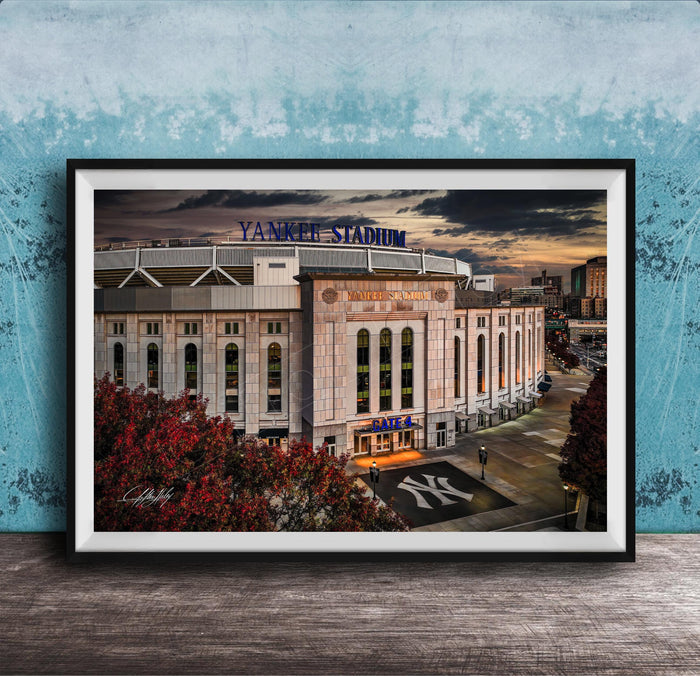 A framed photograph of Yankee Stadium, a baseball stadium in New York City, with the iconic Yankee Stadium sign prominently displayed.