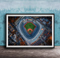 The image is an aerial view of a baseball stadium, specifically the New York Yankees stadium, with the field and surrounding buildings visible.