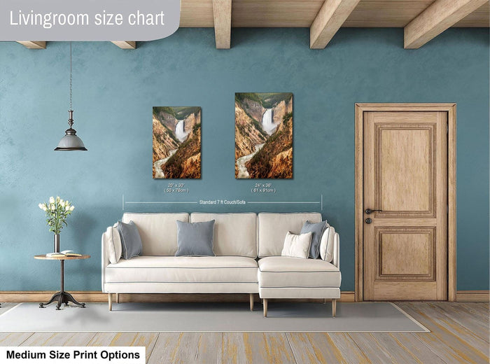 a living room with a white sofa, a wooden door, and a painting of a waterfall on the wall. The living room appears to be designed for relaxation and comfort, with a focus on the artwork and the overall aesthetic.