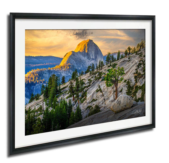 a breathtaking mountain landscape with a large, majestic peak in the distance, surrounded by a lush forest and a dramatic sky with vibrant colors.