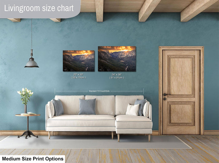 a living room with a white sofa, a wooden door, and a painting of a mountain landscape on the wall.