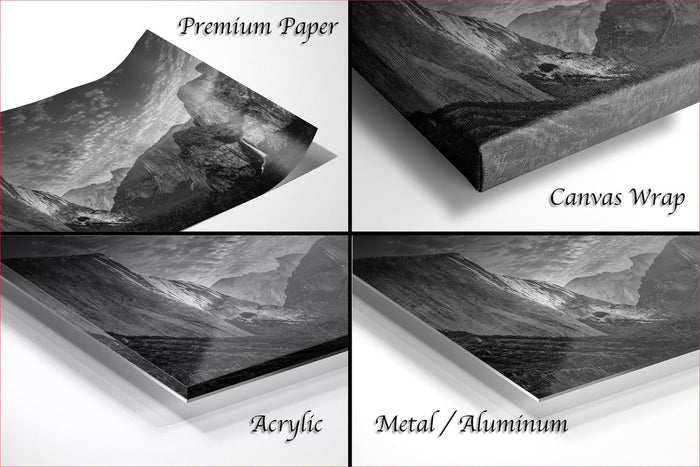 four different views of a black and white landscape photograph, including a canvas wrap and a printed paper.